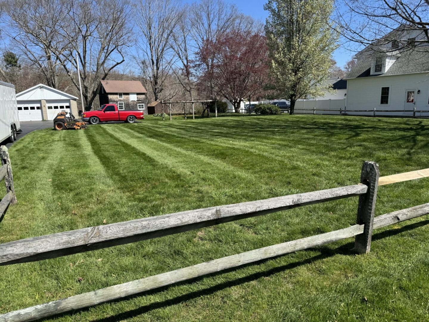 A fence is shown in the foreground of this yard.