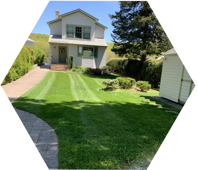 A house with a lawn in the middle of it